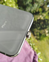 Chargeasap UNO Micro USB tip in the port of an Android Mobile phone