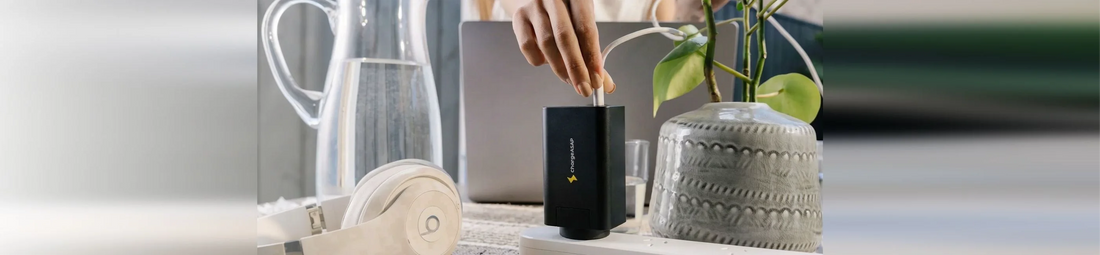 Hand plugging a cable into the Chargeasap Zeus 280W charger on a desk