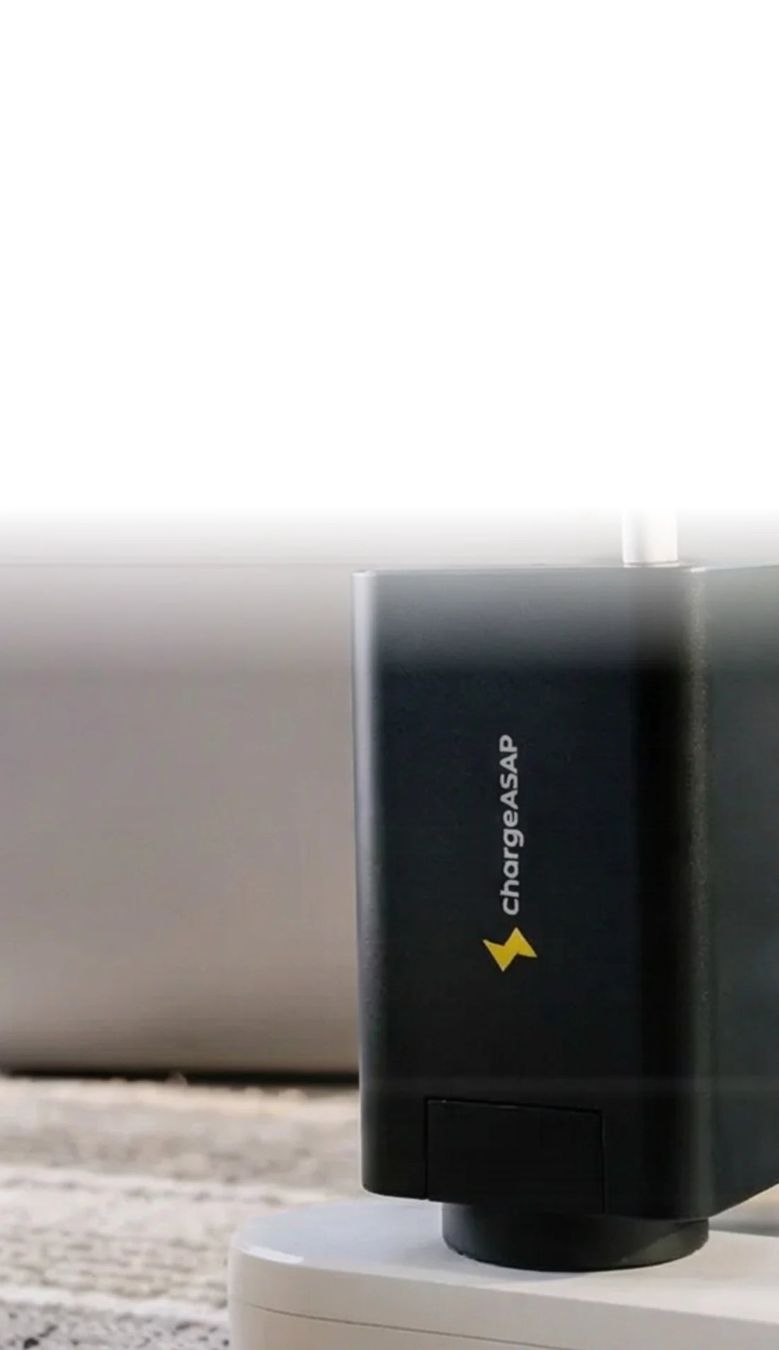 Hand plugging a cable into the Chargeasap Zeus 280W charger on a desk