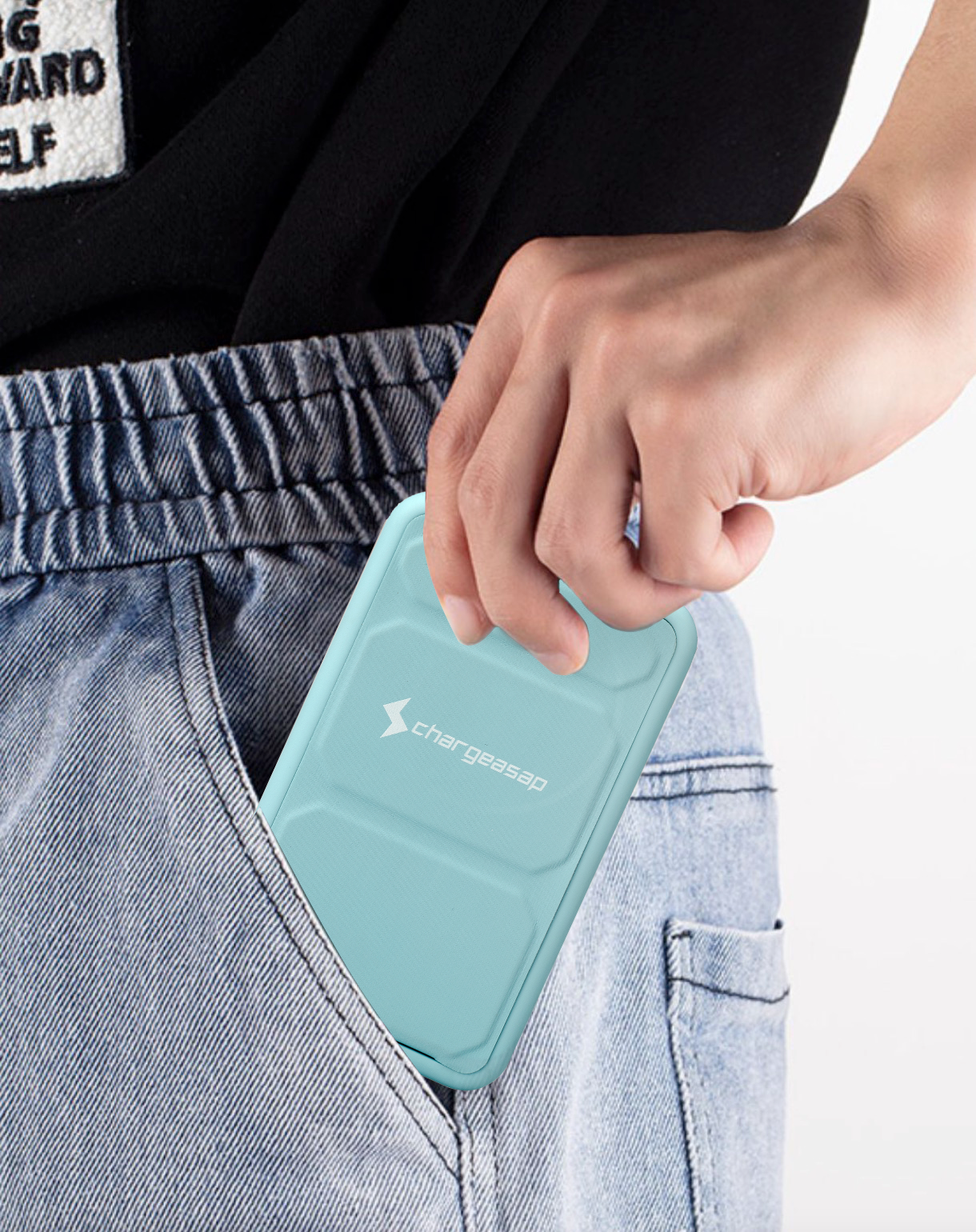person putting iphone with magnetic powerbank in pocket