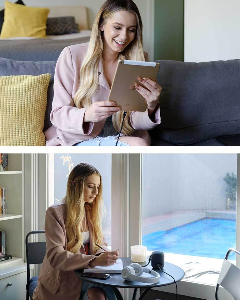 female using Infinity Magnetic USB-C charging cable with iPad and wireless speakers