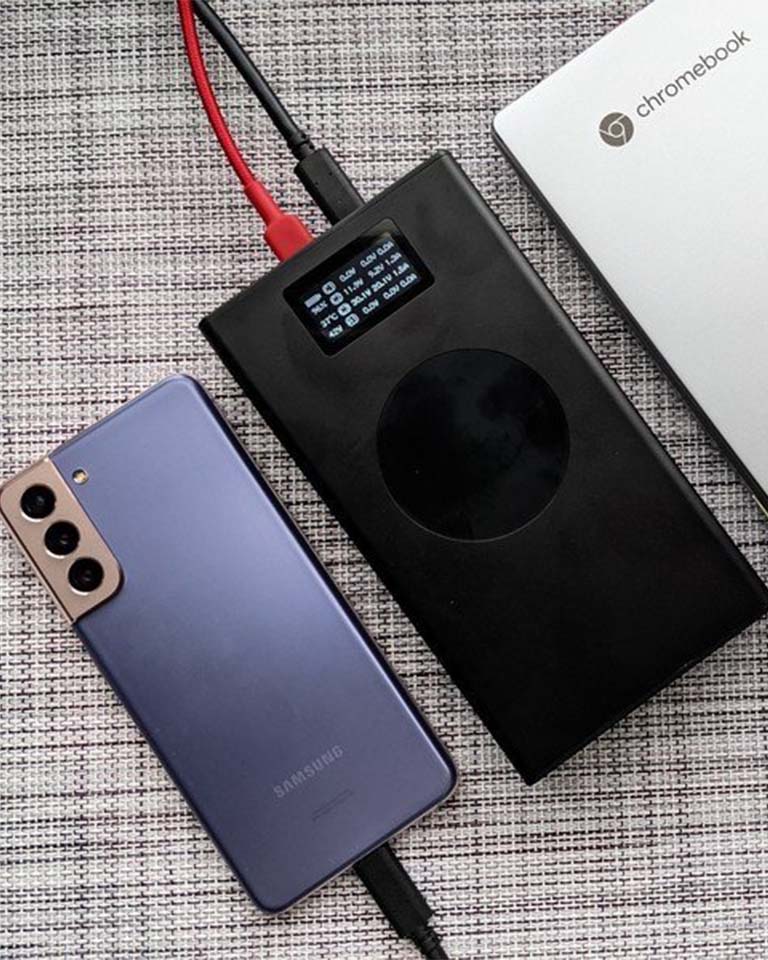 Front facing Image of Graphene Powerbank, Flash Pro charging Chromebook and Samsung phone. 25000mAh large battery capacity, OLED display, USB-C 100W fast charging, wireless charger up to 15W, and Perfect for Android mobile and laptop users 